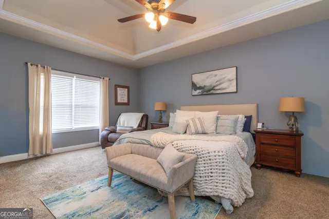 a bedroom with a bed and a television in it