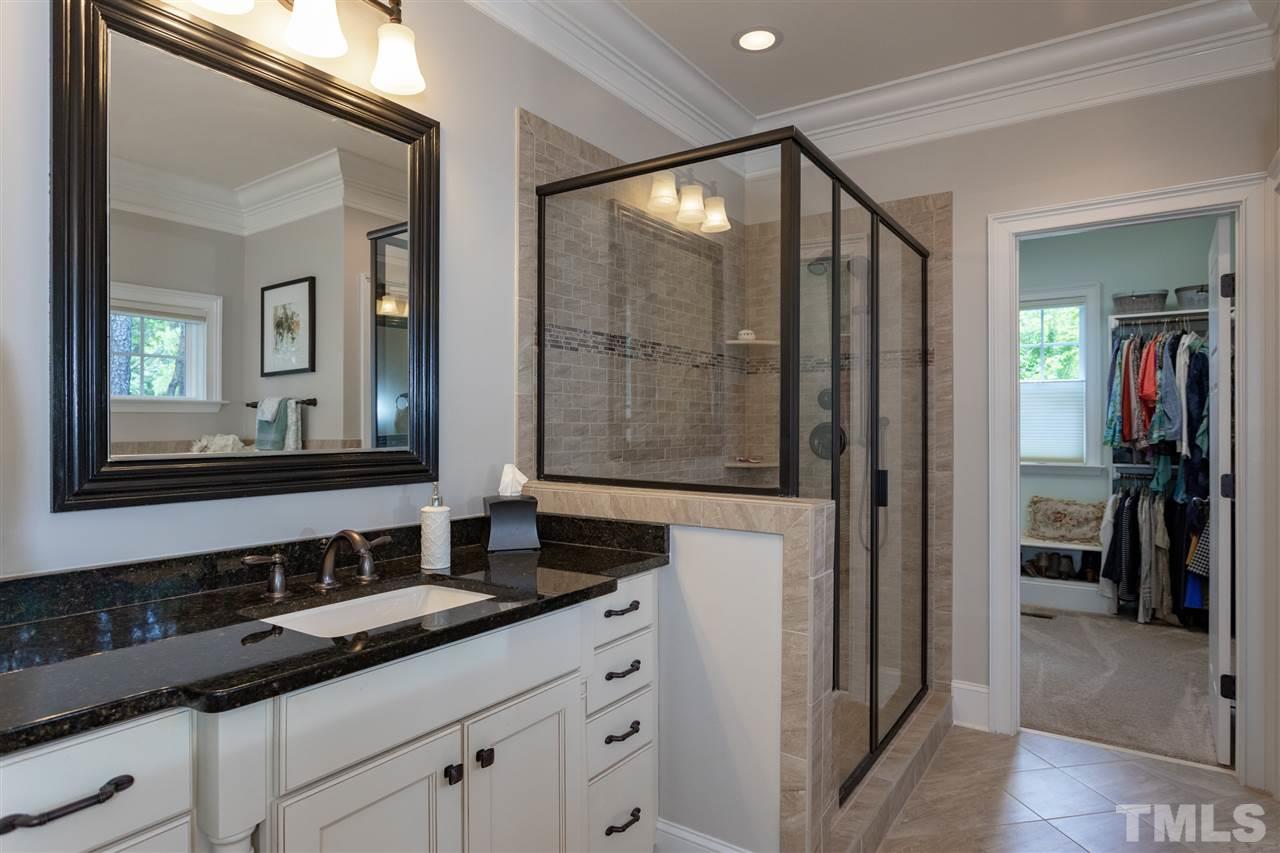 1224 Harrison Ridge Road Wake Forest, NC 27587 - Photo 12 of 25 Dual his and her vanities, walk in closet, separate tiled shower and soaking tub.