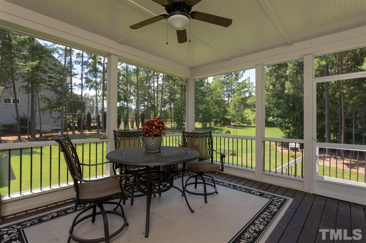 1224 Harrison Ridge Road Wake Forest, NC 27587 - Photo 21 of 25 Great screen porch overlooking private sodded yard with irrgation