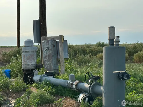 a view of a field with an ocean view