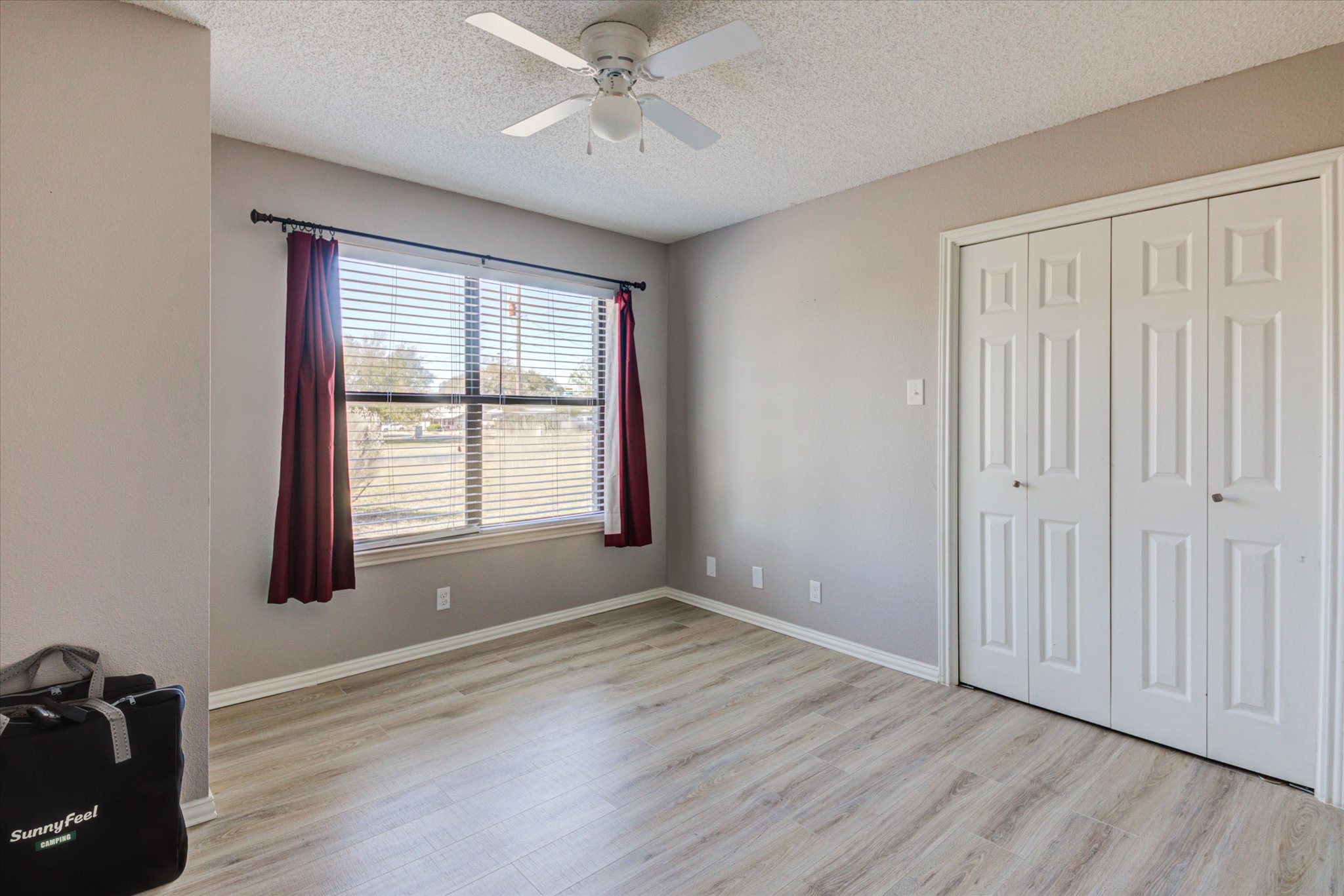 200 Harbor Circle Georgetown, TX 78633 - Photo 17 of 38 a view of an empty room with wooden floor and a window