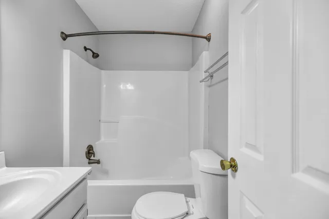 a bathroom with a toilet and a bathtub