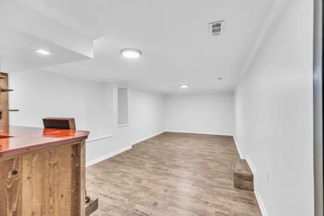 a view of a kitchen with furniture and a window
