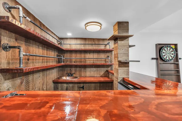 a view of a hallway with a kitchen
