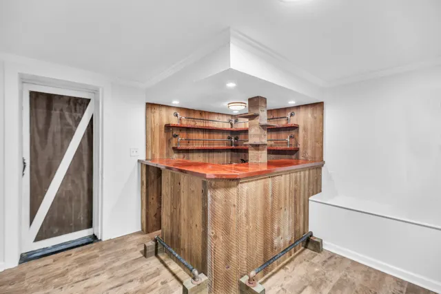 a view of a brick house with a small yard