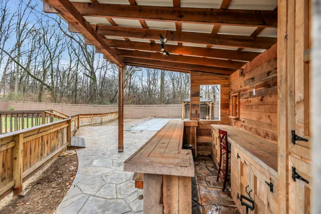 a view of a terrace with a barbeque