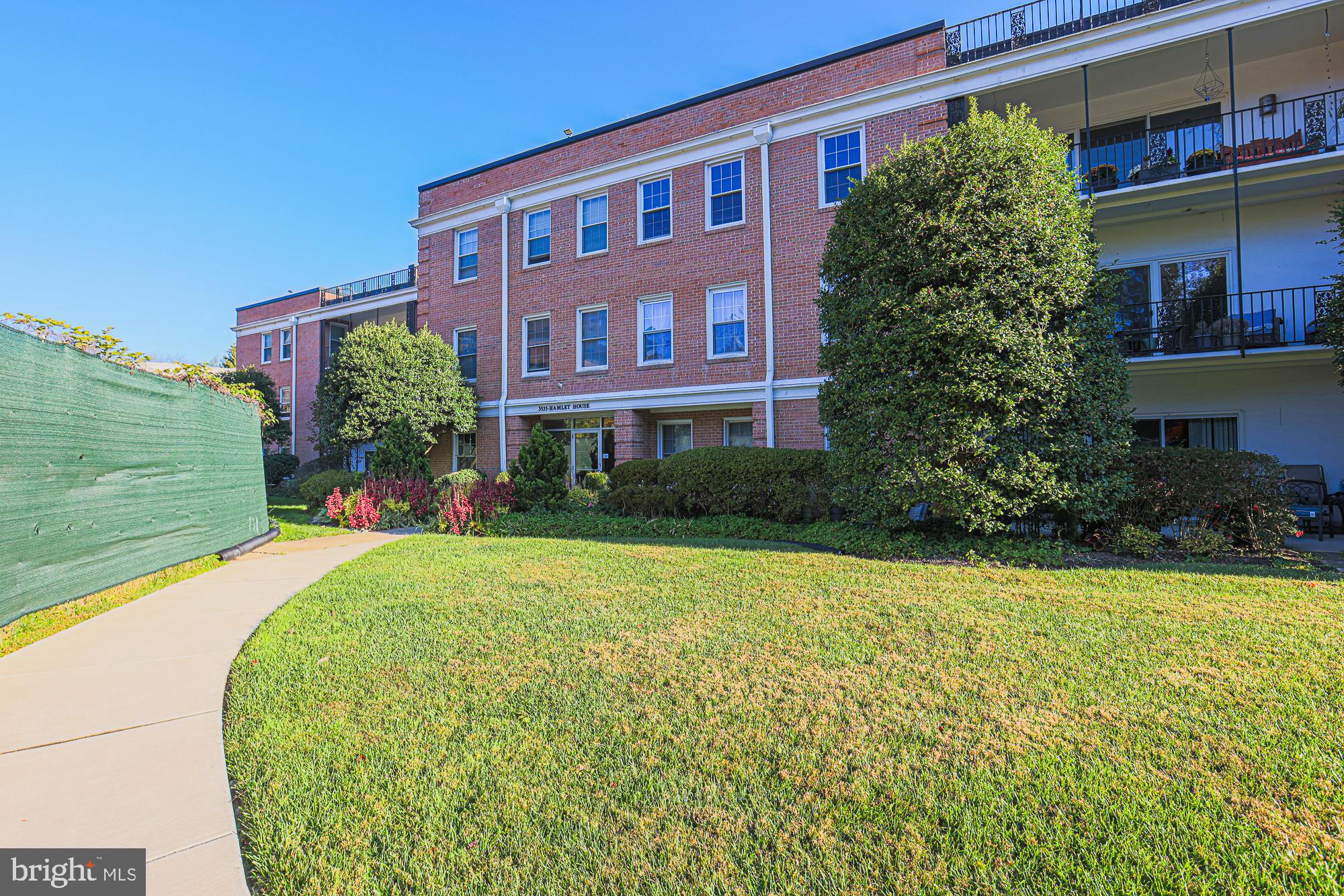 3535 Chevy Chase Lake Drive, Unit 310 Chevy Chase, MD 20815 - Photo 2 of 40 a front view of a house with garden