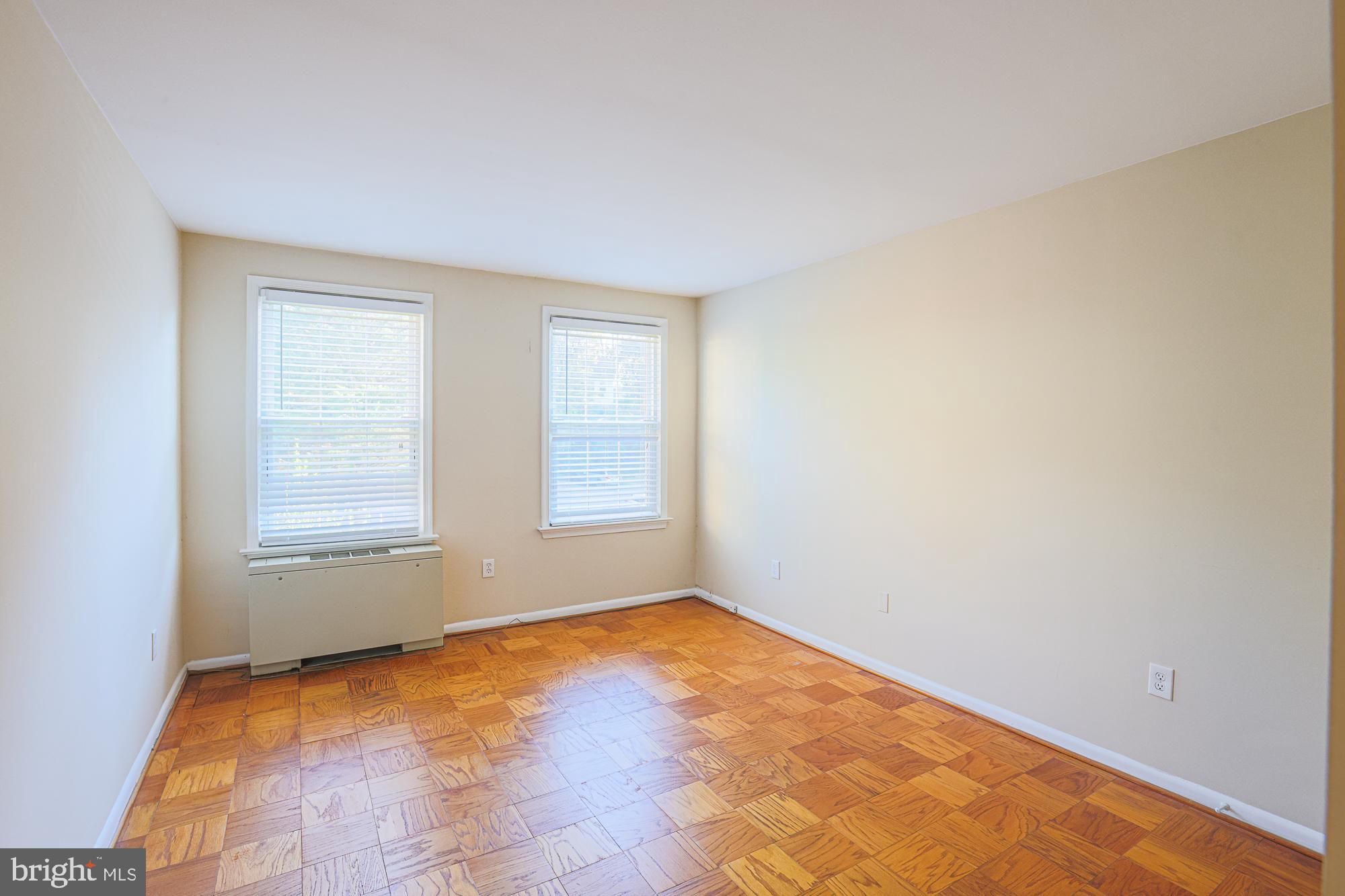 3535 Chevy Chase Lake Drive, Unit 310 Chevy Chase, MD 20815 - Photo 21 of 40 an empty room with a window