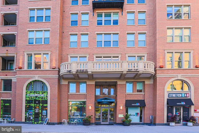 a view of a building with sitting area