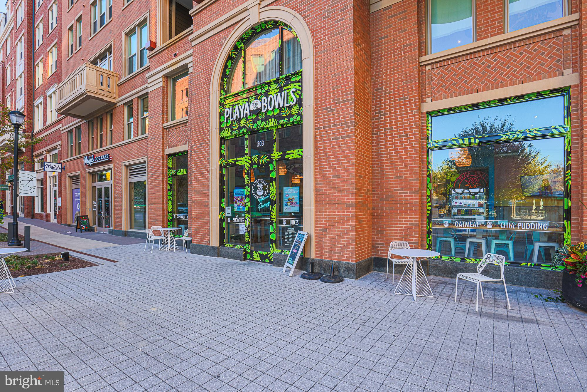 3535 Chevy Chase Lake Drive, Unit 310 Chevy Chase, MD 20815 - Photo 25 of 40 a view of a building with sitting area
