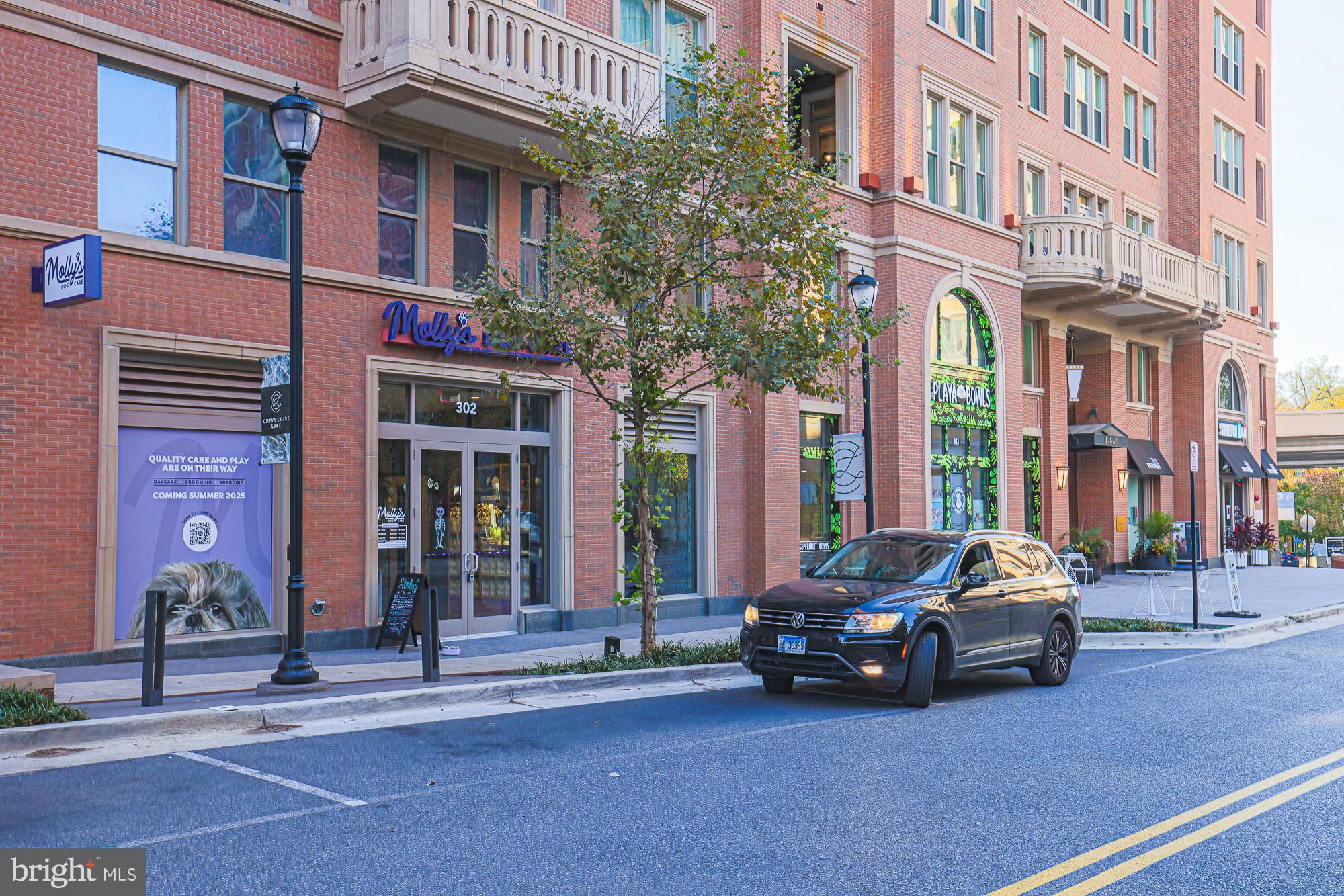 3535 Chevy Chase Lake Drive, Unit 310 Chevy Chase, MD 20815 - Photo 26 of 40 a car parked in front of brick building
