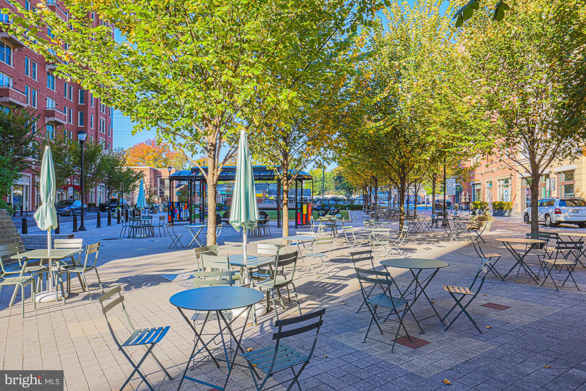 3535 Chevy Chase Lake Drive, Unit 310 Chevy Chase, MD 20815 - Photo 27 of 40 a view of a patio with chairs and tables