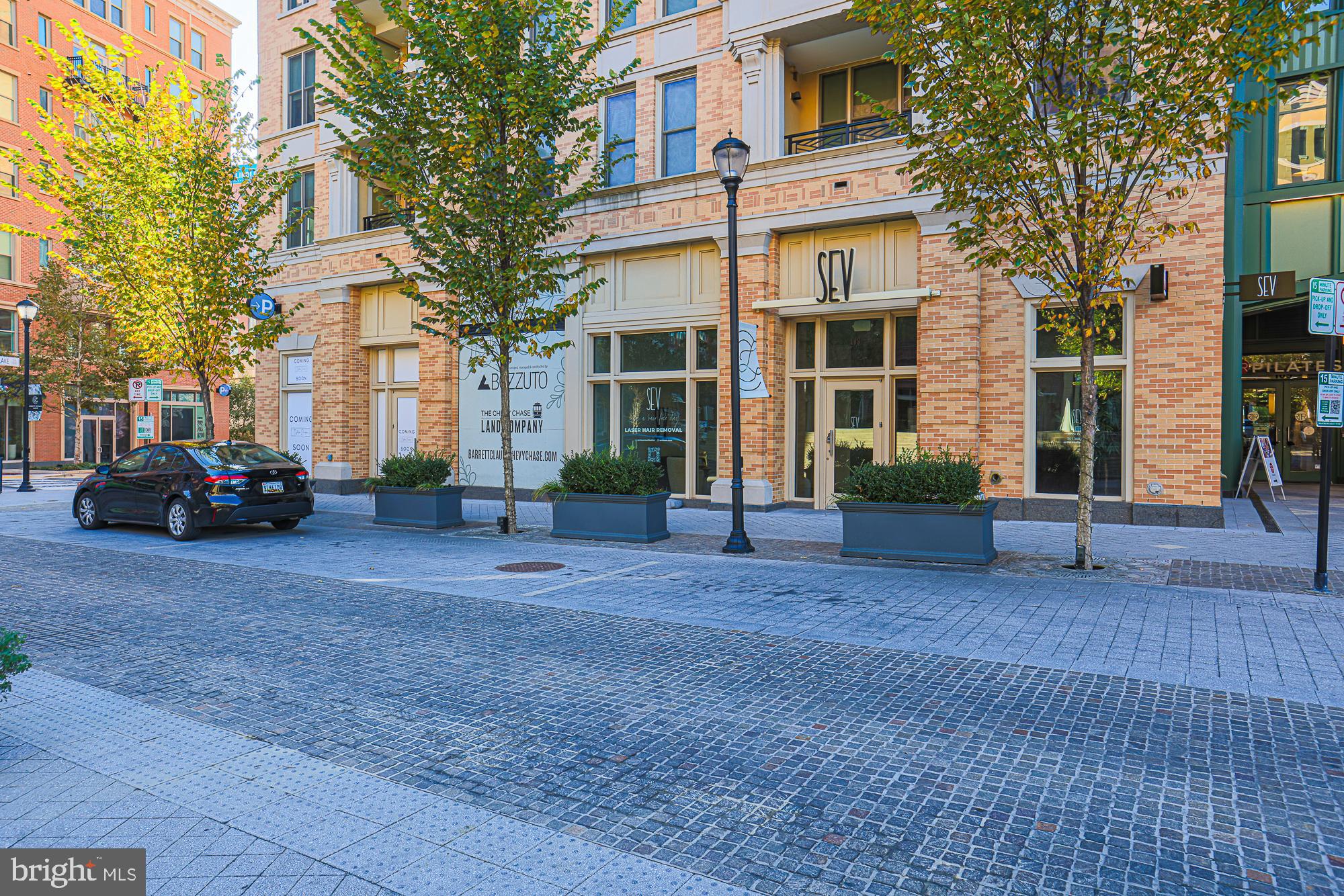 3535 Chevy Chase Lake Drive, Unit 310 Chevy Chase, MD 20815 - Photo 28 of 40 a view of a parked cars in front of a building