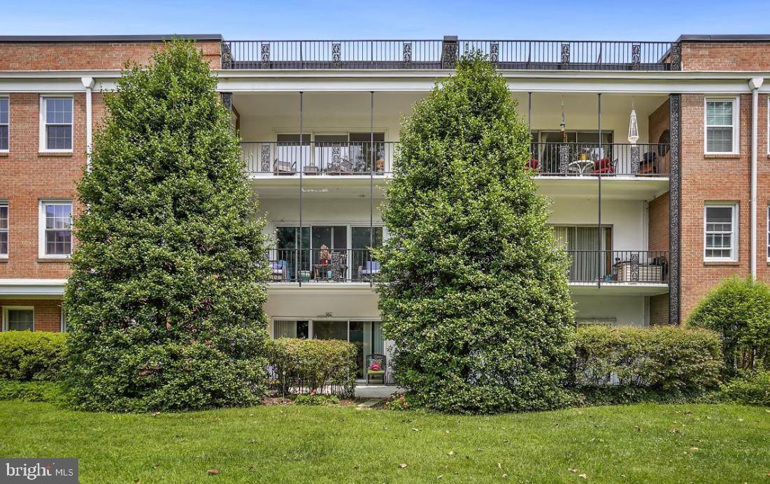3535 Chevy Chase Lake Drive, Unit 310 Chevy Chase, MD 20815 - Photo 3 of 40 front view of a house with a yard