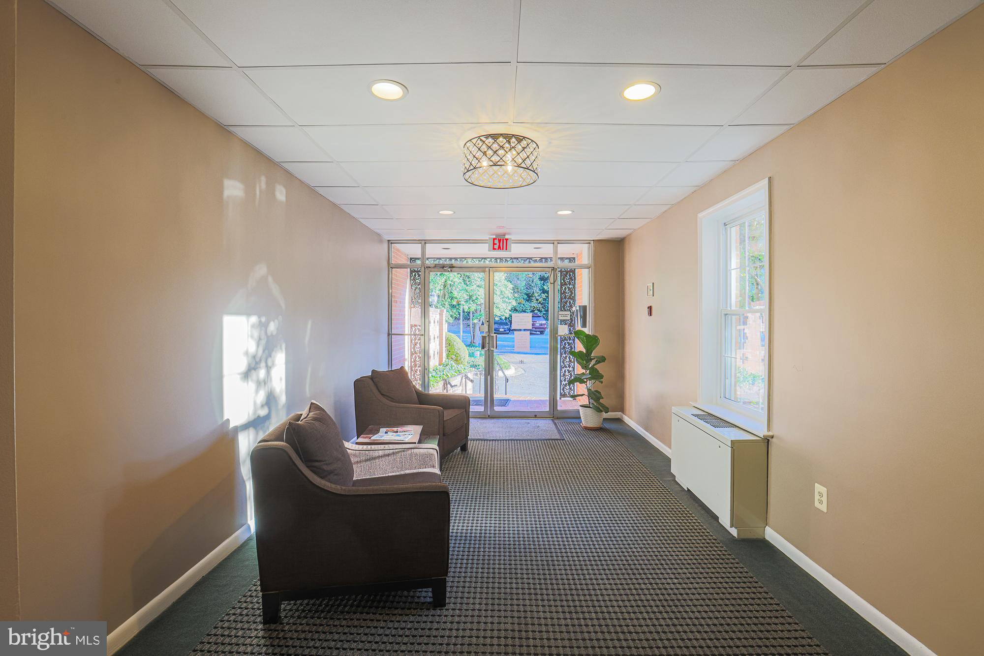 3535 Chevy Chase Lake Drive, Unit 310 Chevy Chase, MD 20815 - Photo 6 of 40 a living room with furniture