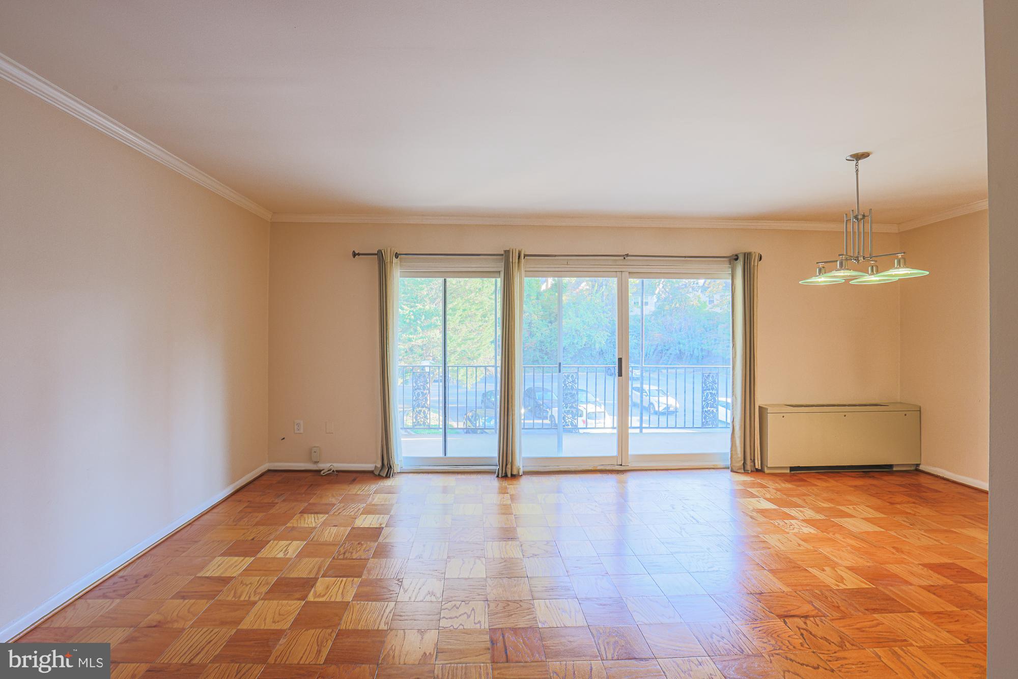 3535 Chevy Chase Lake Drive, Unit 310 Chevy Chase, MD 20815 - Photo 7 of 40 a view of an empty room with a window