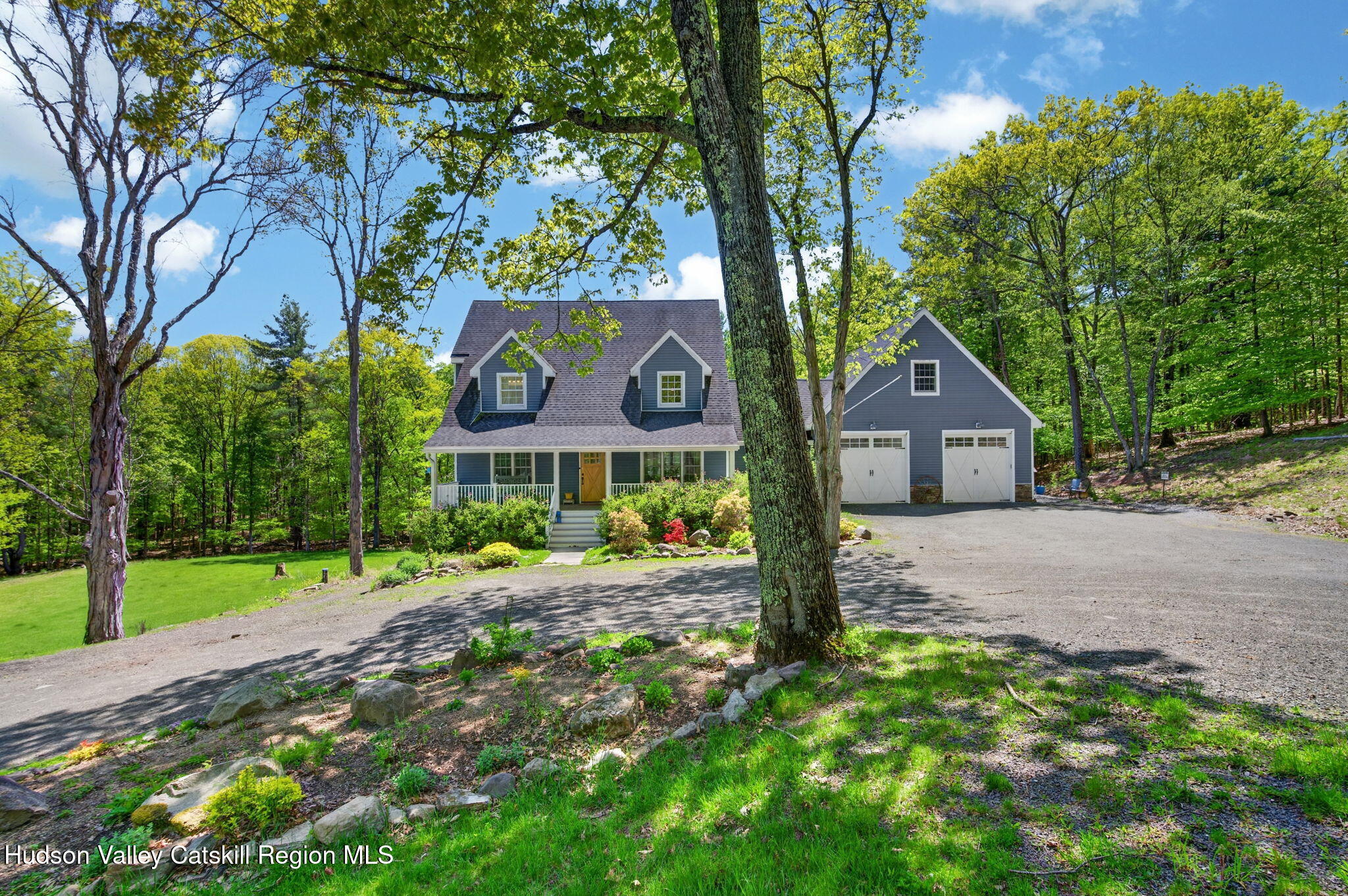 322 Morrison Road Acra, NY 12405 - Photo 42 of 49 a front view of a house with a yard and large trees