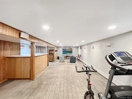 a view of a living room with furniture and a window