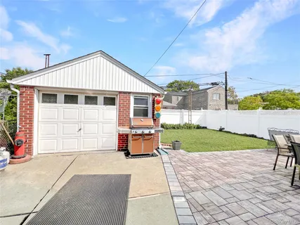 a view of a patio with table and chairs and potted plants