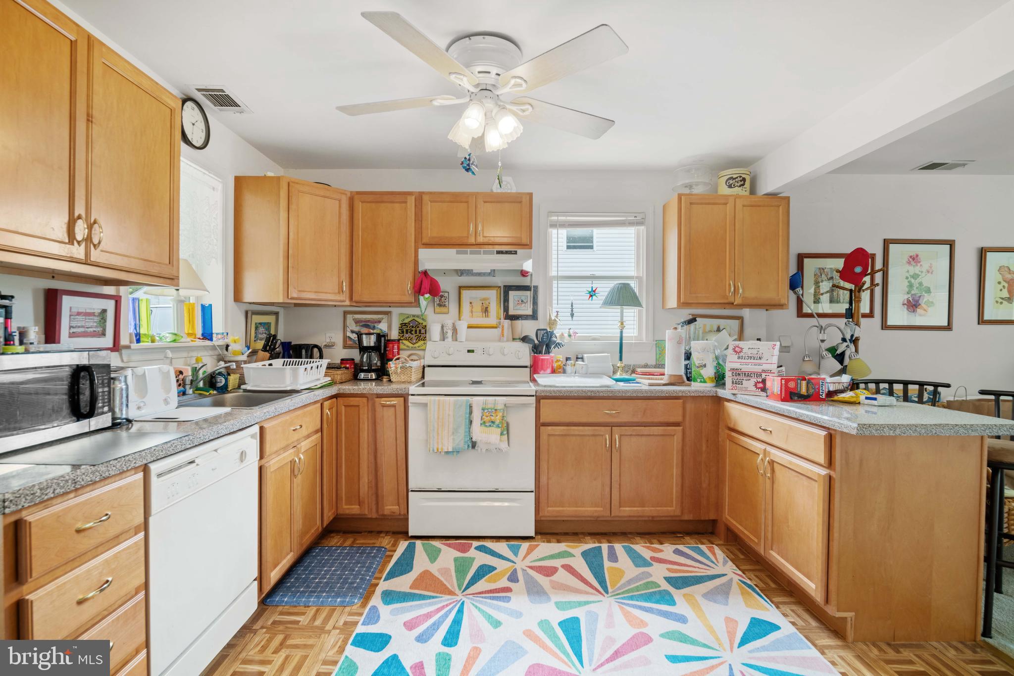 5930 Sneed Drive Deale, MD 20751 - Photo 26 of 38 a kitchen with kitchen island a white cabinets and window