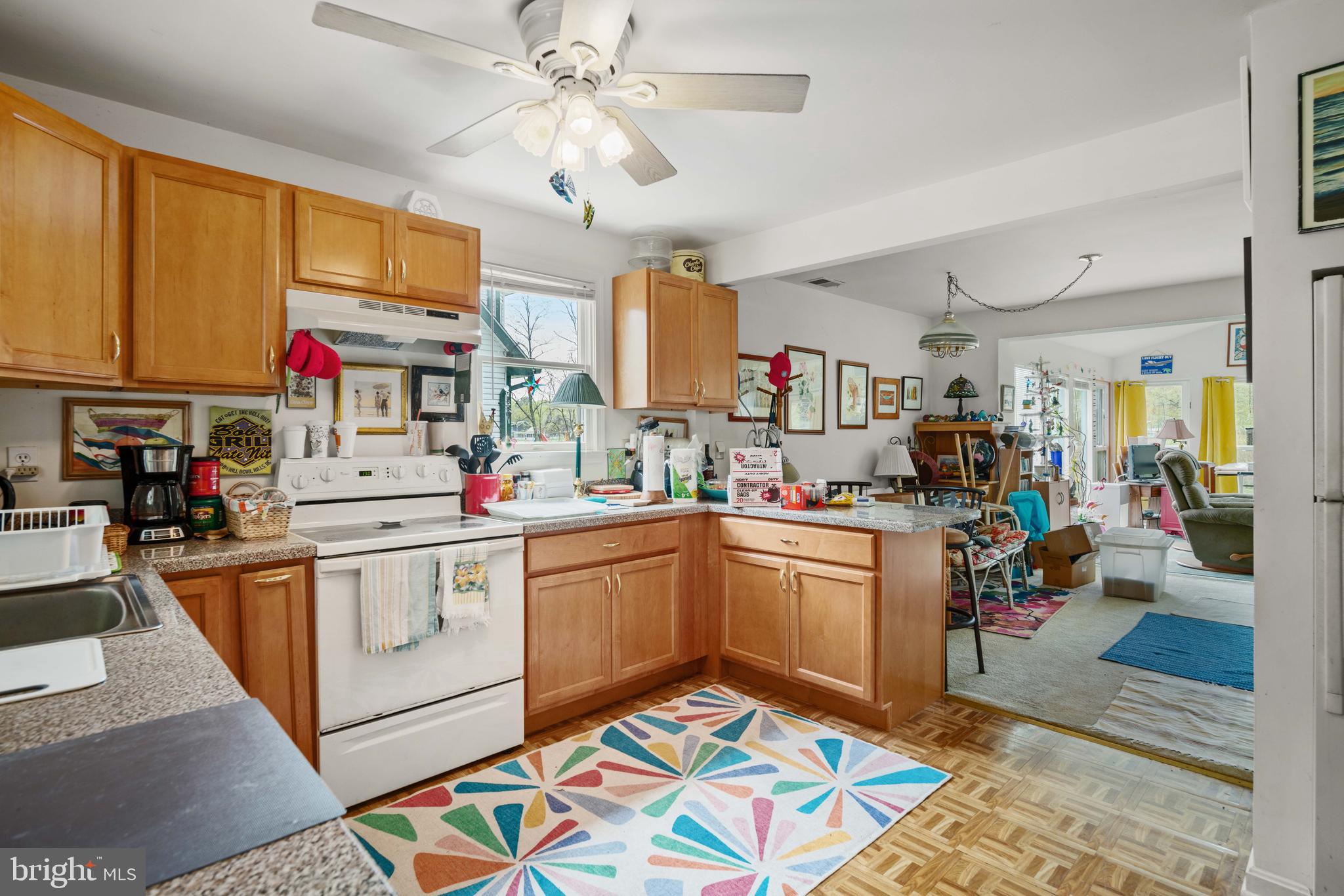 5930 Sneed Drive Deale, MD 20751 - Photo 27 of 38 a kitchen with stainless steel appliances granite countertop a sink dishwasher and a stove with wooden floor