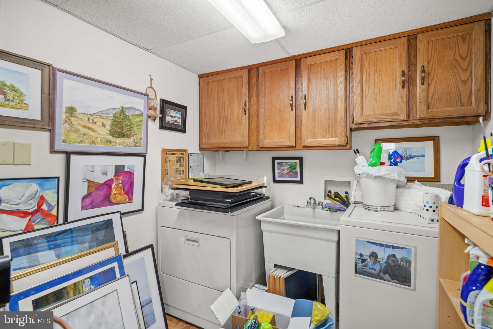 5930 Sneed Drive Deale, MD 20751 - Photo 35 of 38 a utility room with fridge and wooden floor