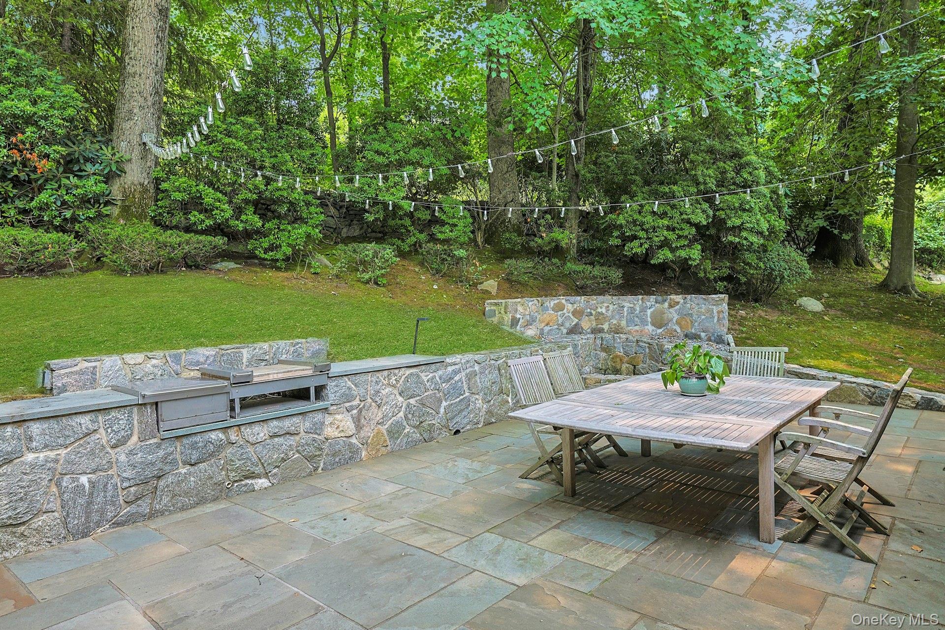 20 Sprain Valley Road Scarsdale, NY 10583 - Photo 25 of 30 Gather around the built-in fire pit while enjoying the privacy of the professionally landscaped grounds and thoughtfully designed stonework.