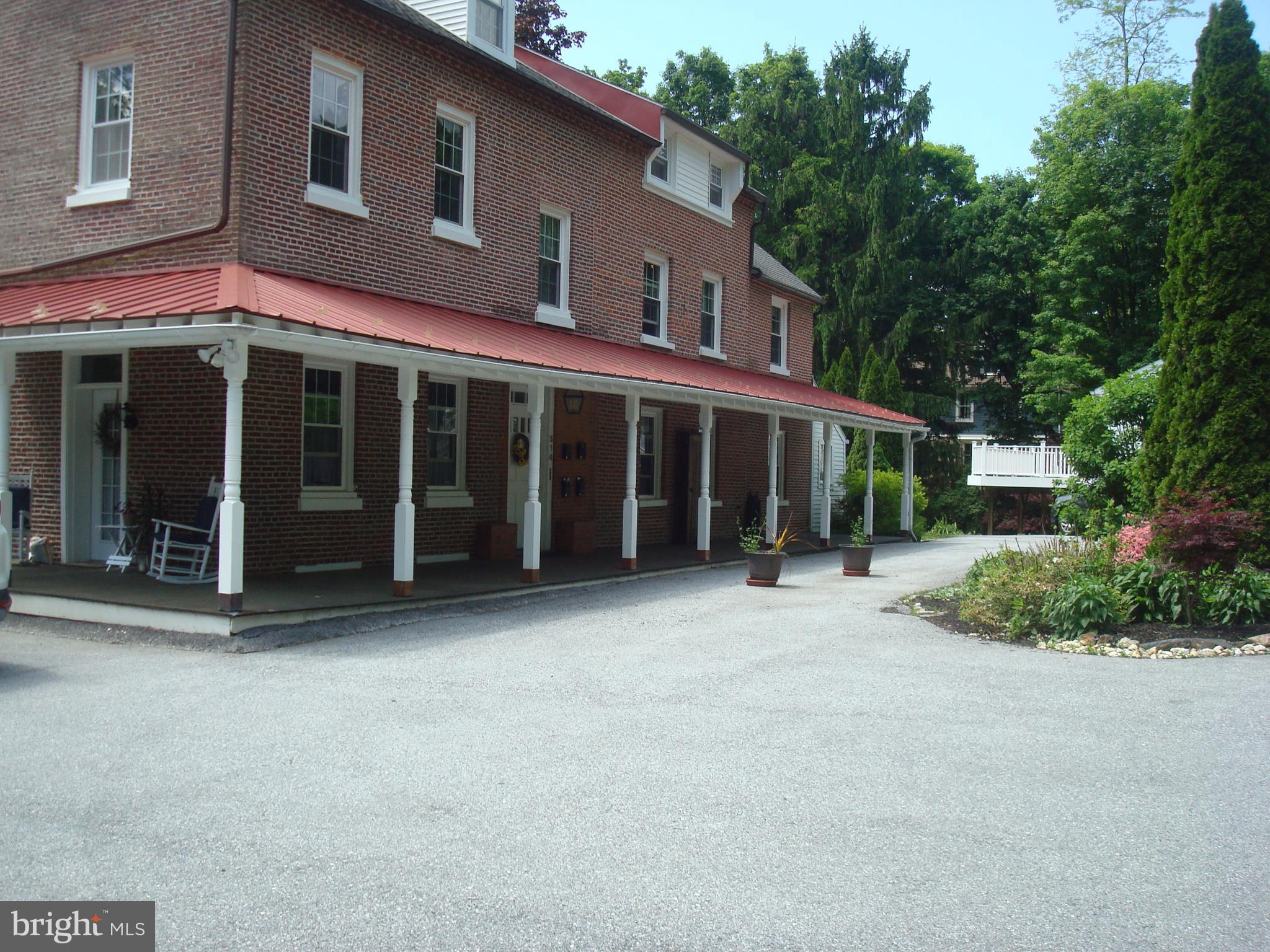 514 Spring Grove Lane, Unit 3 West Chester, PA 19382 - Photo 3 of 35 front view of a building with a garden