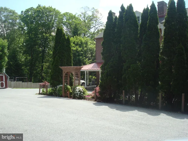 a potted plant sitting in front of a house