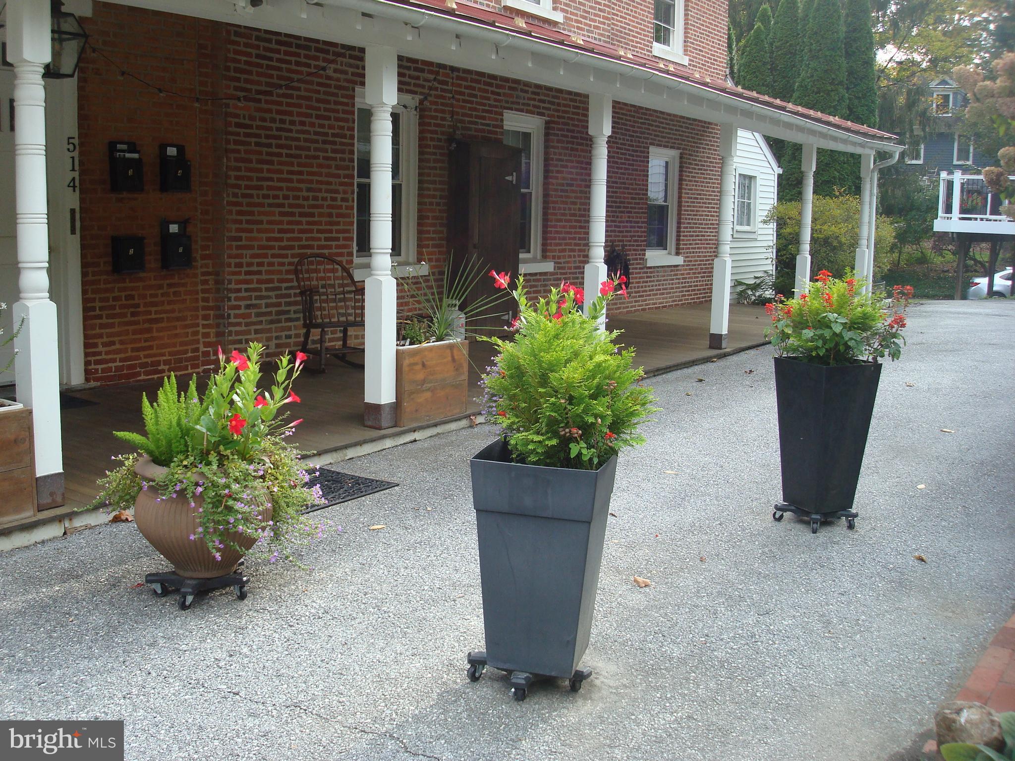 514 Spring Grove Lane, Unit 3 West Chester, PA 19382 - Photo 34 of 35 a potted plant sitting in front of a house