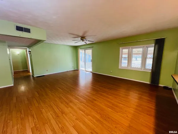 a view of an empty room and window