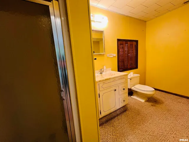 a view of a room with wooden walls