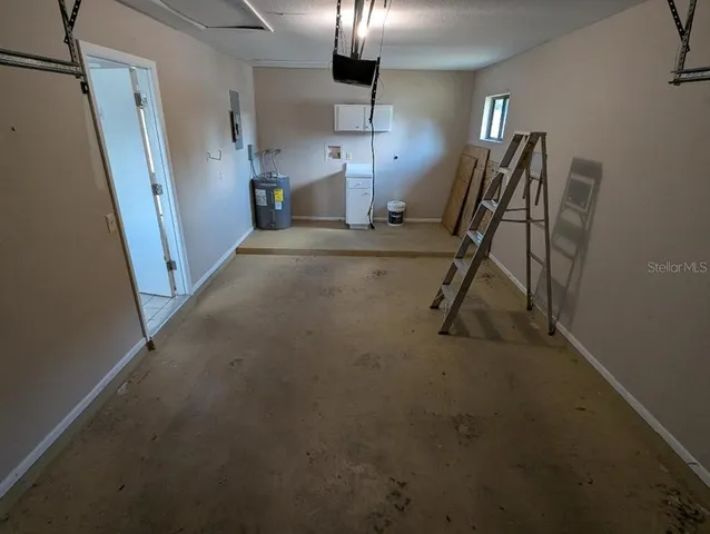 a view of a livingroom with furniture and a staircase