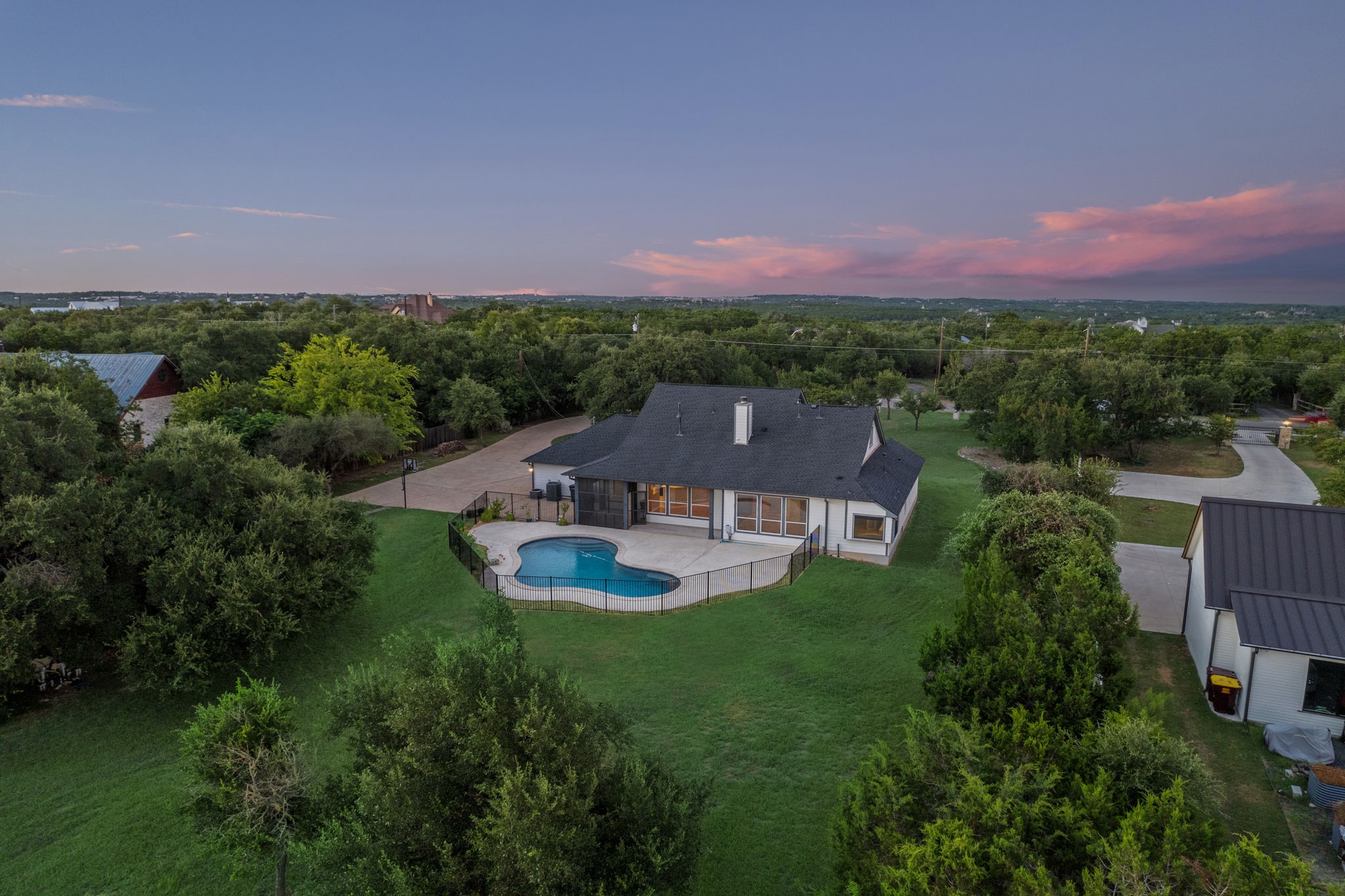9103 Zyle Road Austin, TX 78737 - Photo 1 of 1 The grass has been virtually enhanced.