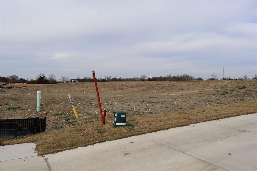 119 Timber Cv Place Heath, TX 75032 - Photo 11 of 15 a view of a lake with a big yard