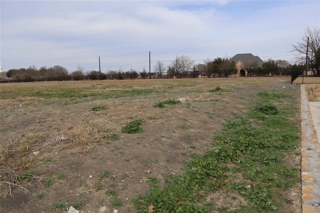 119 Timber Cv Place Heath, TX 75032 - Photo 13 of 15 a view of a field with trees in background