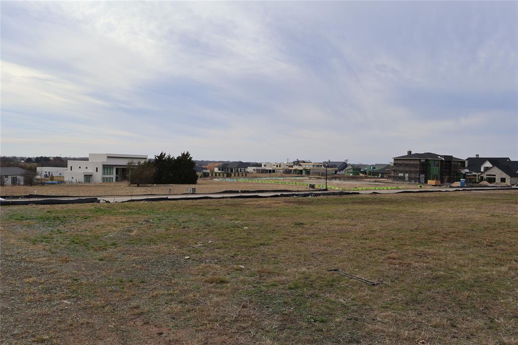 119 Timber Cv Place Heath, TX 75032 - Photo 14 of 15 a view of a lake with houses