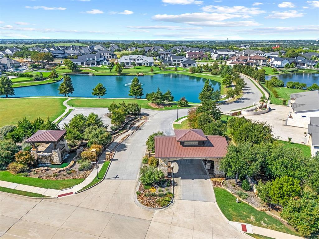 119 Timber Cv Place Heath, TX 75032 - Photo 2 of 15 an aerial view of a houses with a lake view