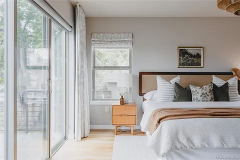 a bedroom with a bed and window
