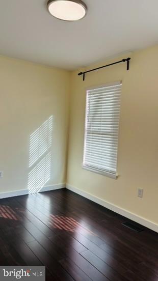 14308 Lindendale Road Woodbridge, VA 22193 - Photo 11 of 39 a view of an empty room with wooden floor and a window