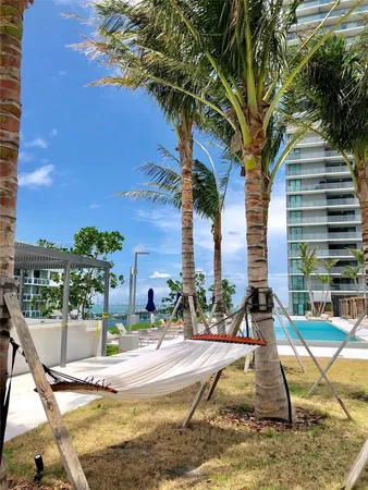 a view of swimming pool with outdoor space and seating area