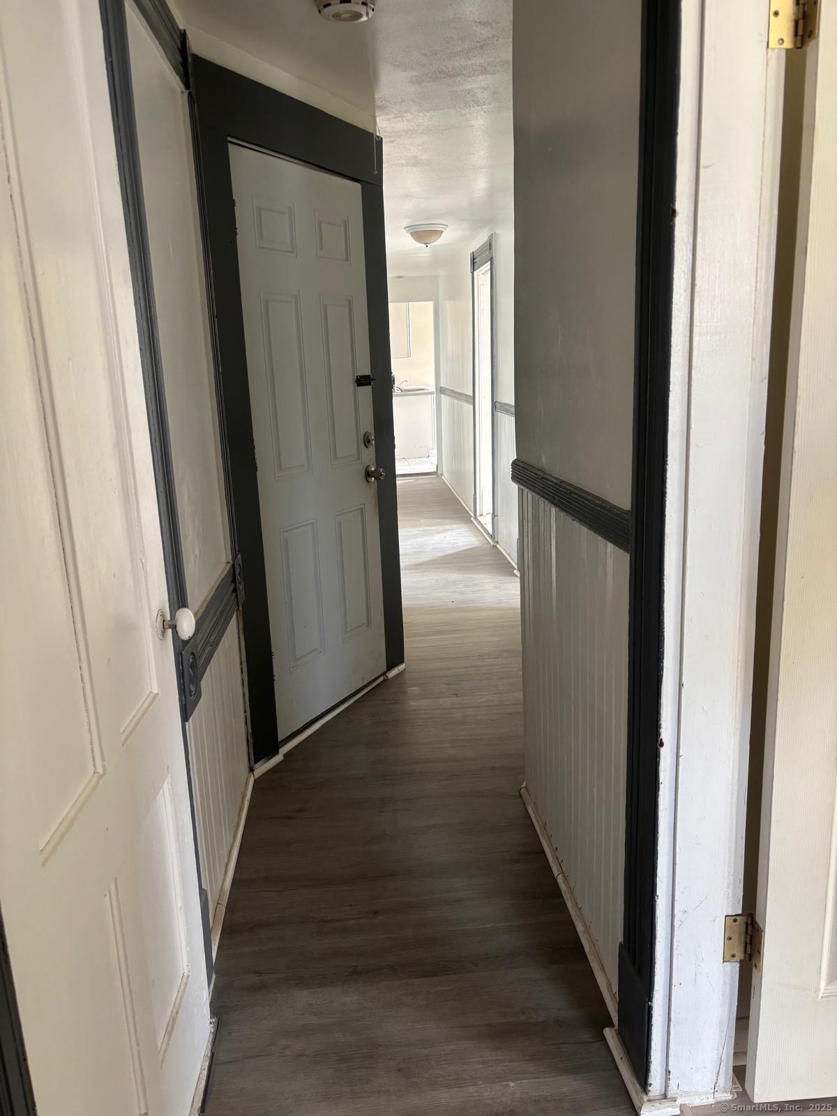 1308 East Main Street Waterbury, CT 06705 - Photo 8 of 10 a view of a hallway with wooden floor