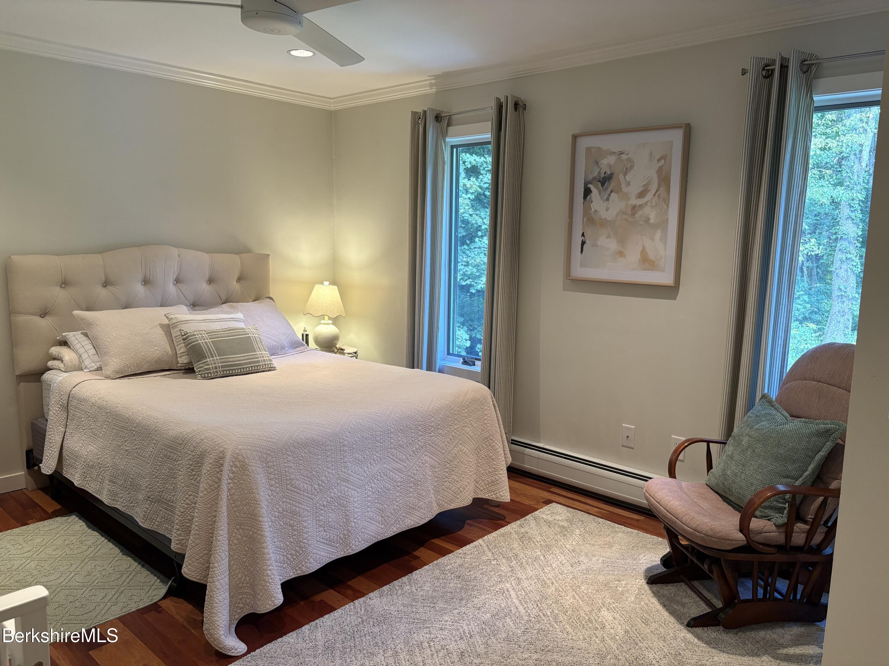 188 Hillsdale Road Egremont, MA 01230 - Photo 20 of 32 a bedroom with a bed and wooden floor