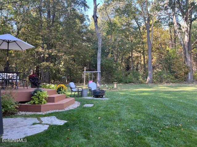 188 Hillsdale Road Egremont, MA 01230 - Photo 30 of 32 a view of a table and chairs under an umbrella