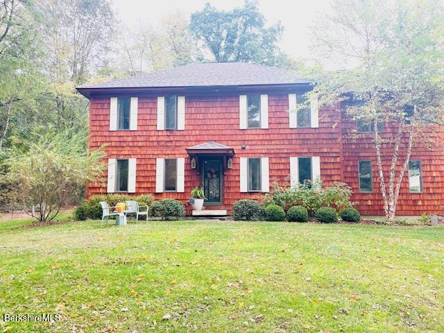 188 Hillsdale Road Egremont, MA 01230 - Photo 32 of 32 a view of a brick building next to a yard with large trees