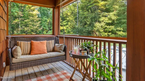 a balcony with wooden floor