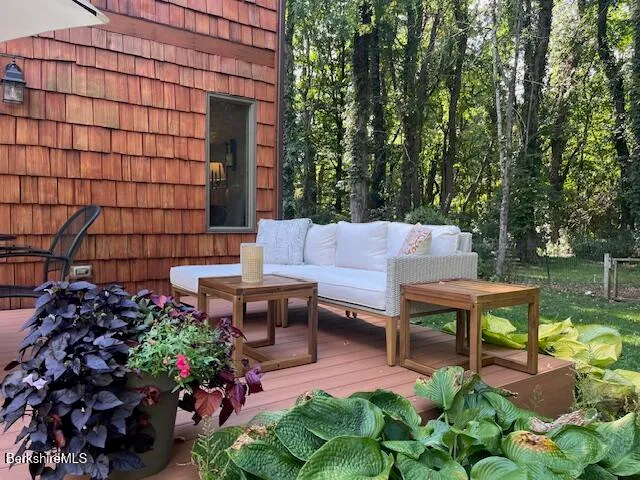 a backyard of a house with outdoor seating