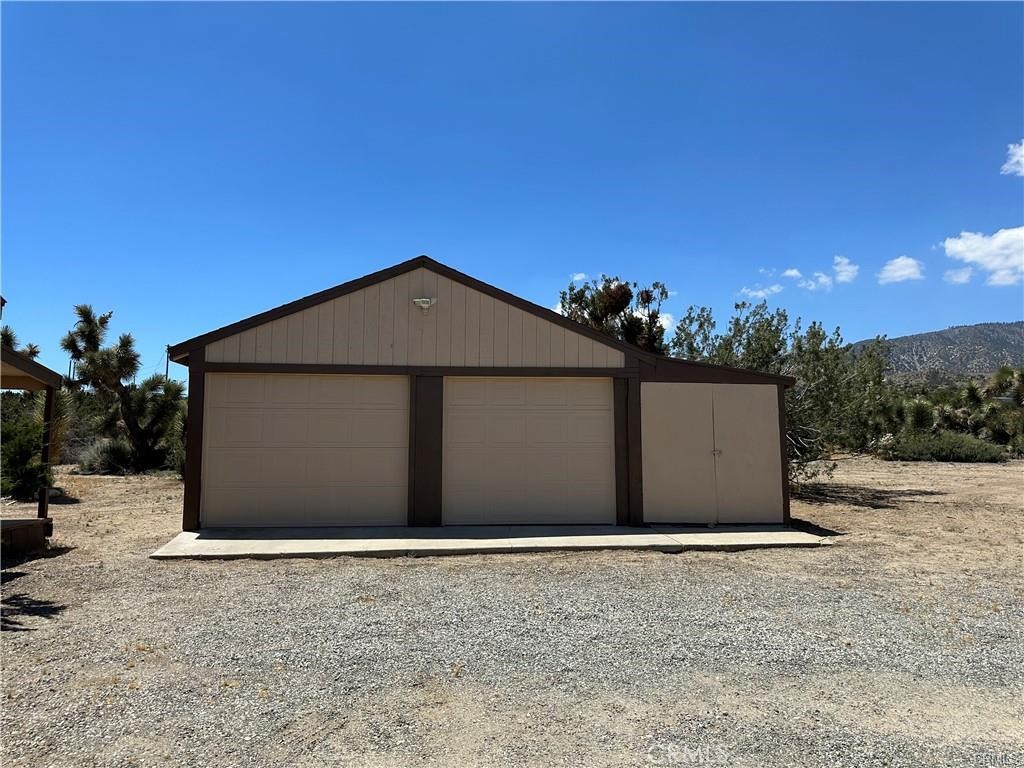 2033 Hollister Road Pinon Hills, CA 92372 - Photo 25 of 25 a front view of a house with a yard