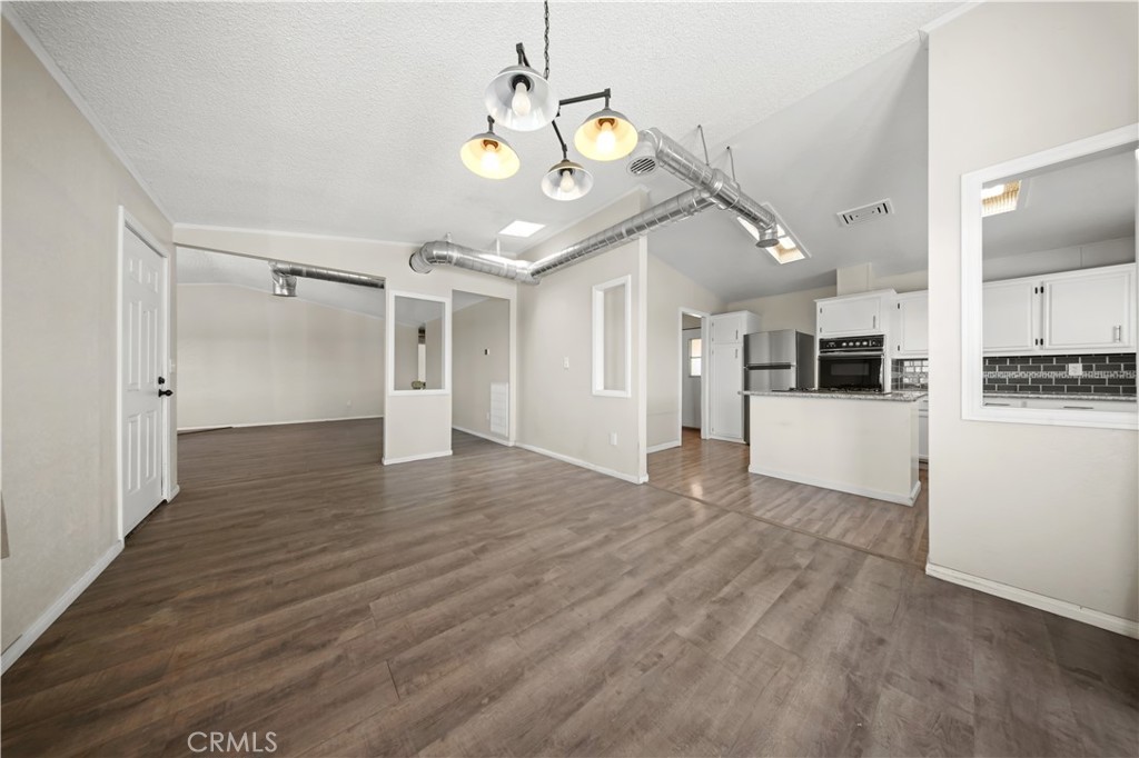 2033 Hollister Road Pinon Hills, CA 92372 - Photo 6 of 25 a view of a livingroom with wooden floor