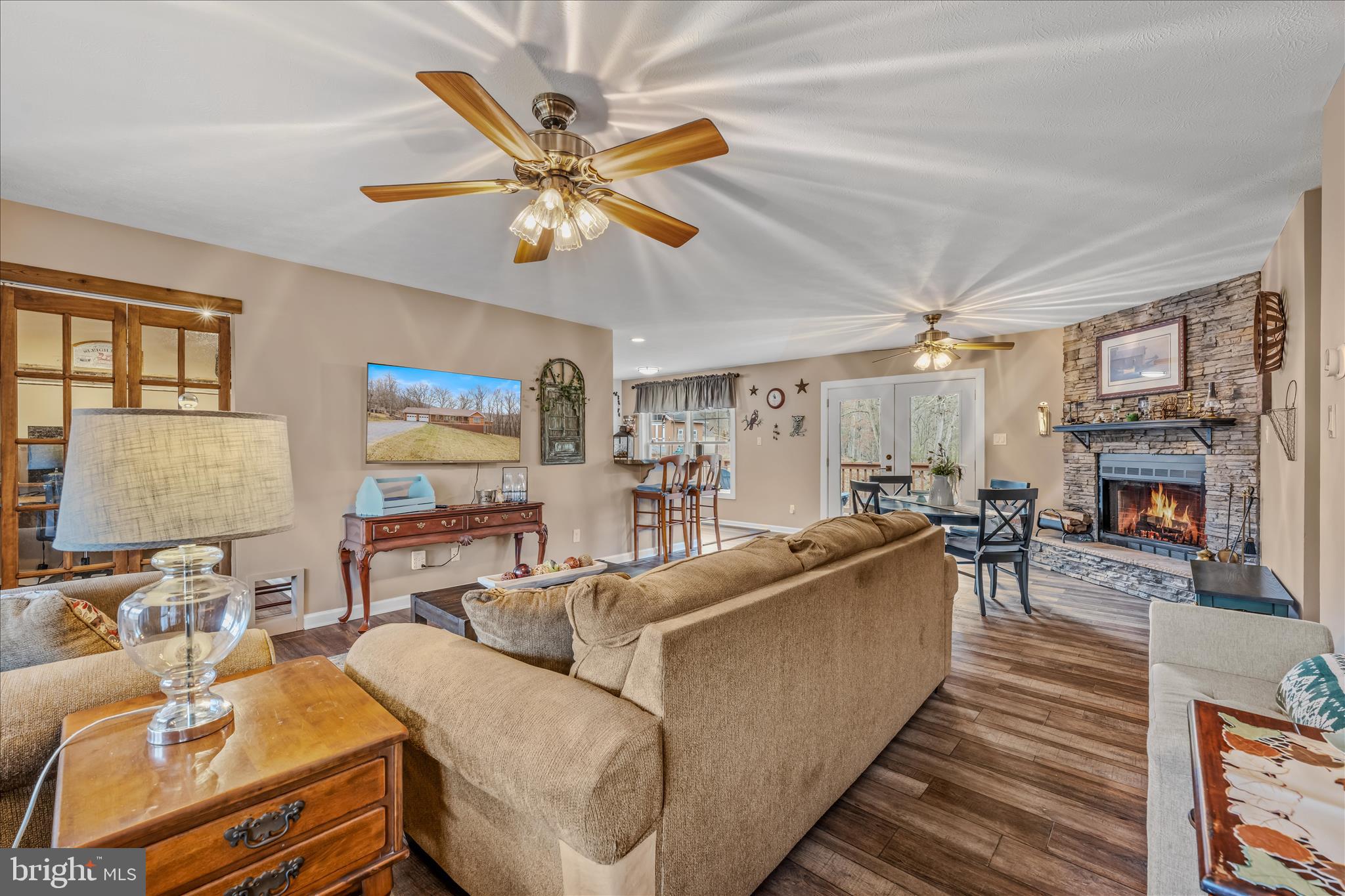 1636 Eckerd Lane Berkeley Springs, WV 25411 - Photo 12 of 85 a living room with furniture and a fireplace